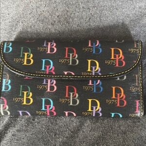Dooney & Bourke Black and Red Wallet with Flap Closure